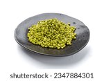 Soaked Mung Beans on Black Plate Isolated, Wet Vigna Radiata Seeds Pile, Macro Photo of Green Gram in Water, Raw Mung Beans, Maash or Moong, White Background