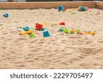 Toys are scattered in a large...