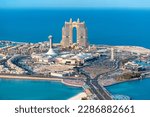Small photo of 15 January 2023, Abu Dhabi, UAE: Aerial view of peninsula with development area and stunning Rixos Marina hotel building