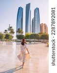 Small photo of Revel in the beauty of Abu Dhabi's breathtaking architecture and multicultural vibrancy, embodied by the elegant figure of an Indian woman.