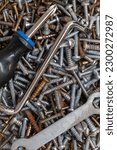 Small photo of Macro photography of screws. Set of screws. construction abstraction. industry background. Macro photo of screws, screw background, steel screw, screw macro.