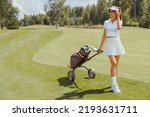 Woman Golf Player Walking On...