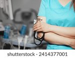 Small photo of Doctor holds his stethoscope to insinuate that it's time for a check up, professional emergency healthcare assistance service concept. Professional doctor ready to listen lungs or heart.
