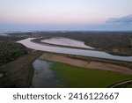 Small photo of Watershed of the Odejouca and Arade rivers in South Portugal, connection of these rivers, view of the mountains and Portimao on the Atlantic Ocean during sunrise