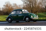 Small photo of Stony Stratford, Bucks, UK, Jan 1st 2023. 1970 green Volkswagen Beetle classic car