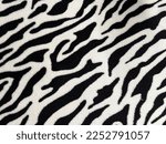 a soft black and white patterned blanket