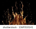 abstract golden liquid splash isolated on black background