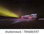 Solheimasandur plane wreck with active norhtern lights, Iceland, Europe.