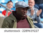 Small photo of Former footballer Dave Hanson makes a celebratory entrance onto the pitch at The Shay Stadium in Halifax, England, marking the 25th reunion of the 97 98 promotion side on April 15th, 2023
