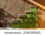 Small photo of Stack of turf grass for lawn. roll of sod, turf grass roll.