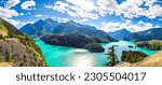 Panorama of a bright blue lake in North Cascades National Park.