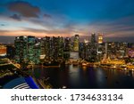 Picturesque panoramic view of Singapore city at sunset. Financial and trading center hub in Asia region. Concept of success. Modern buildings in high-tech world.