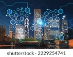 Chicago downtown area city view and Millennium Park, night time, Illinois, USA. Skyscrapers of financial district. Decentralized economy. Blockchain, cryptography and cryptocurrency concept, hologram