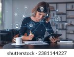 Businesswoman holding tablet device, touching screen. Office workplace. Concept of digital network, Social net connection front hologram, distant work, business education, information technology.