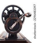 Small photo of Close up of a hand crank of an old sewing machine side view