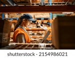 Female Warehouse Worker Working ...