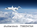Business jet airplane flying on ...