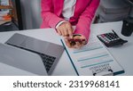 Small photo of Excited Asian bookkeepers doing bookkeeping, accounts payable, assets, book value, equity, inventory, liabilities, cost of goods sold, depreciation, expenses, Gross profit, diversification, liquidity