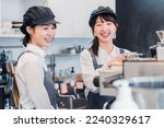 Small photo of A woman working part-time in a restaurant happily learning about her duties