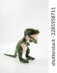 Small photo of Tyrannosaurus or trex dinosaur toy in green