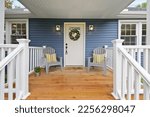 Front door and wooden porch on...