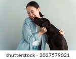 Cute Young Woman Hugs Her Puppy ...