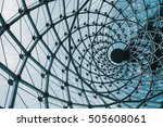 Structural glass facade curving roof of fantastic office building. Modern and Contemporary architectural fiction with glass steel column.Abstract architecture fragment.