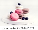French Colorful Macarons Colorful Pastel Macarons on White Background Whitr Pink and Brown Macaron with Fresh Blueberry