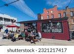 Small photo of Mobile Alabama USA, Nov 24th 2019. People enjoy breakfast in the sun outside a diner in Mobile Alabama USA