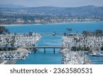 Small photo of Dana Point, CA, USA - September 18, 2023: Aeriel view of the Dana Point Harbor with sea fog rolling onto the shore.