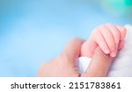 Small photo of Baby infant finger hand with mother loving care.World baby day.Newborn cute.Mom and her Child.Premature or preterm baby in hospital.incubator intensive safe.foster child.Orphans infant.black people.
