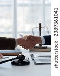 Small photo of Lawyers shake hands with business people to seal a deal with partner lawyers or a lawyer discussing contract agreements, handshake concepts, agreements.