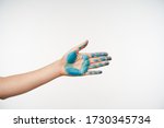 Small photo of Side view of female's hand with blue colour on it being raised while going to shake somebody's hand, spreading it ahead while posing over white background