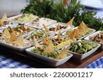 Small photo of Appetizer counter. Turkish appetizer varieties. Fresh vegetarian salad. Fish appetizers. Greek appetizers. Garniture, salad food. Cold garnish. Intermediate cold meals. Fish restaurant.