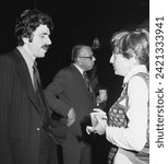 Small photo of Jerry Kretchmer with Janie Eisenberg Author at New York reception October 1974 with many journalists and reporters. He later opened the Gotham bar and grill in Greenwich Village to much success.