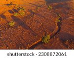 Small photo of Aerial view of dried river beds running through a barren red outback landscape near Broken Hill In New South Wales, Australia