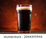A Glass Of Dark Beer In The...