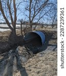 Small photo of A ditch and culvert diverting the spring thaw