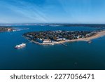 Small photo of Sandbanks is an affluent neighbourhood of Poole, Dorset, on the south coast of England, situated on a narrow spit of around 1 km2 or 0.39 sq mi extending into the mouth of Poole Harbour.
