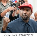 Small photo of Washington, DC US - Oct 11, 2018: Kanye West speaks as he meets with US President Donald J. Trump in the White House Oval Office. Credit: Ron Sachs - CNP