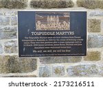 Small photo of Plymouth England. June 2020. Bronze plaque on the Barbican detailing the arrival back to England of some of the Tolpuddle martyrs after their exile to Australia for attempting to form a trade union