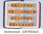 Small photo of Vancouver, BC, Canada - Circa April 2023: Scrabble letters spelling Bible Verse Exodus 19:5 Obey my voice and keep my covenant