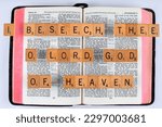 Small photo of Vancouver, BC, Canada - Circa April 2023: Scrabble letters spelling Bible Verse Nehemiah 1:5 I beseech thee O Lord God of heaven
