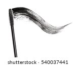 Stroke of black mascara with applicator brush close-up, isolated on white background