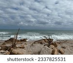 Small photo of Angry Mediterranean Sea under a blustery cloudy sky