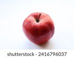 Small photo of limp apple on white background