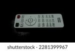 Small photo of BenQ projector remote control with black background