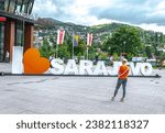 Small photo of Sarajevo, Bosnia and Herzegovina- August 15 2019: I love Sarajevo sign in front Sarajevo City Center as BH Telecom company campaign