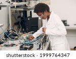 Small photo of Scientist african american black woman working in laboratory and single photon decoder encoder fiber optic cryptography.