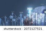 Small photo of Concept of planning and strategy. Stock market. Business growth. progress or success idea A business man or trader is showing a growing virtual hologram stock. Invest in trading in 2022-2024